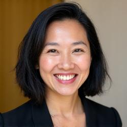 Professional headshot of Maya Devi, a FinLykke Edu financial advisor, looking approachable.